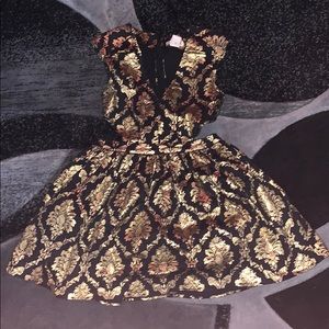 black and gold mini cocktail dress.